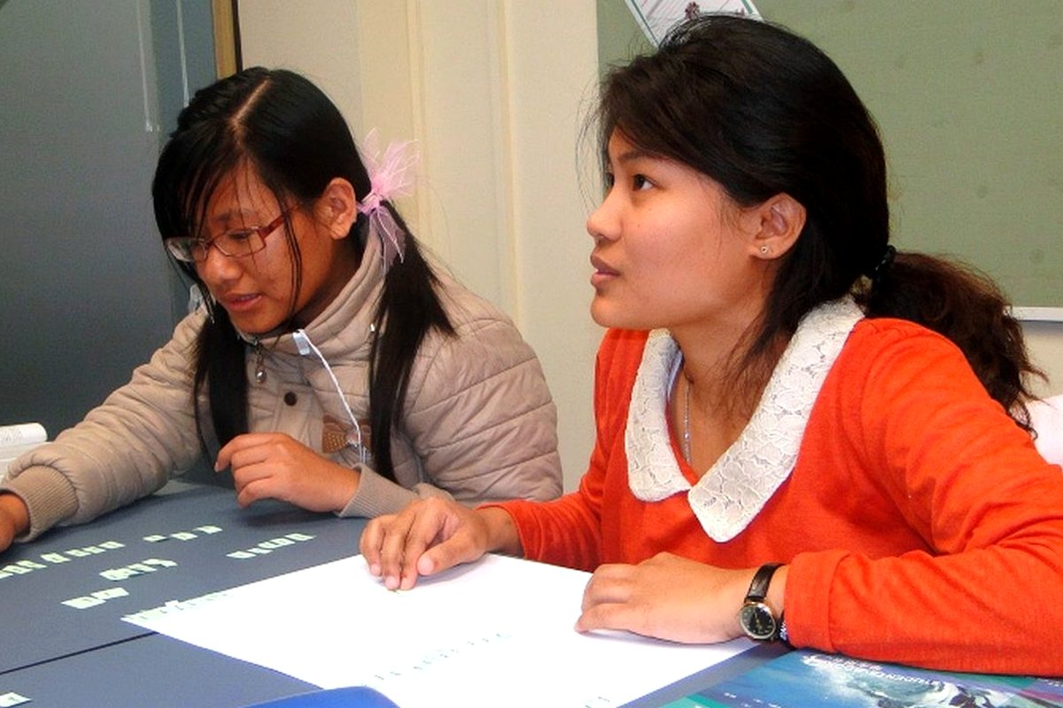 Students studying English in a WIE classroom