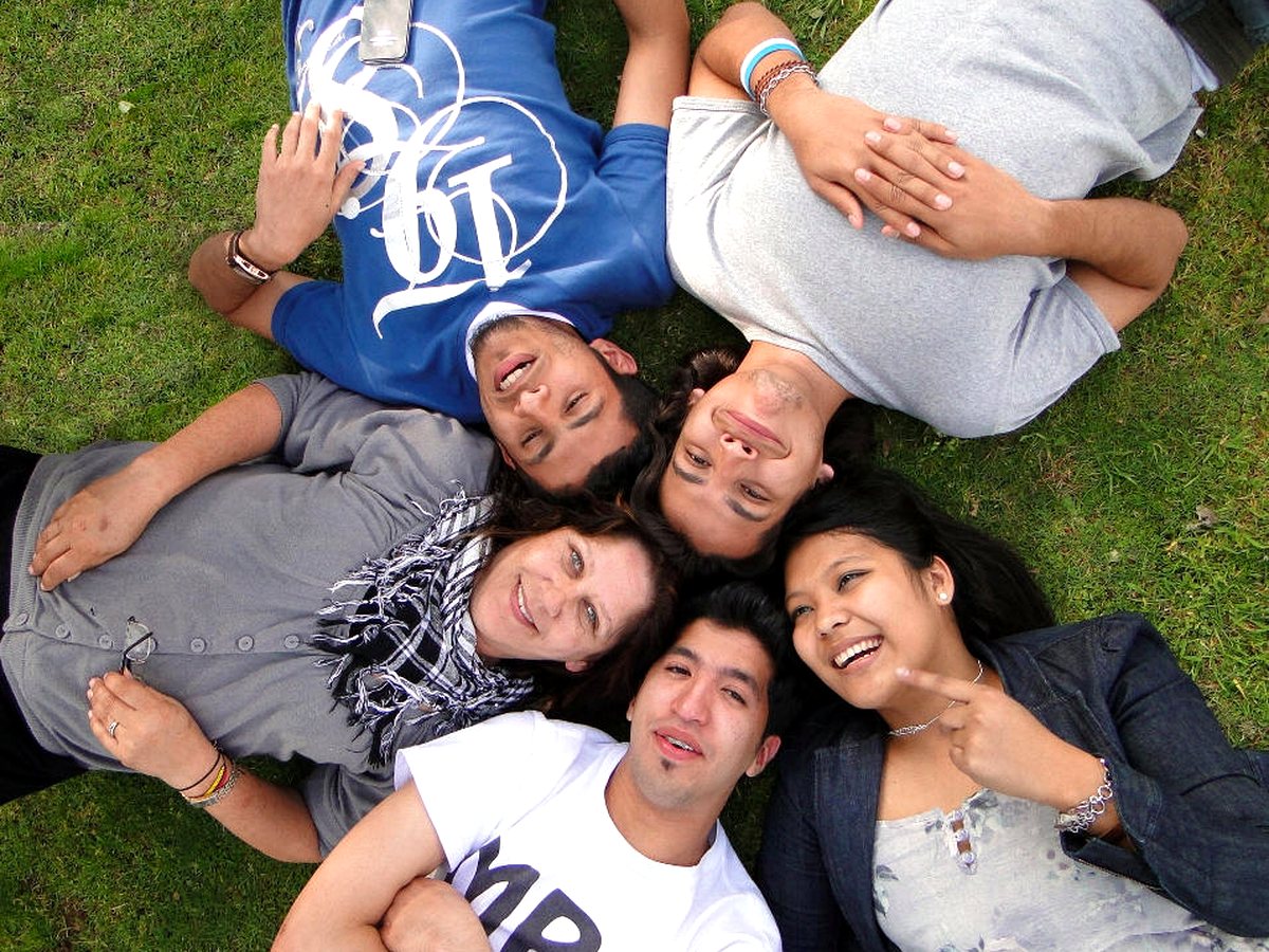 WIE students relaxing together outdoors