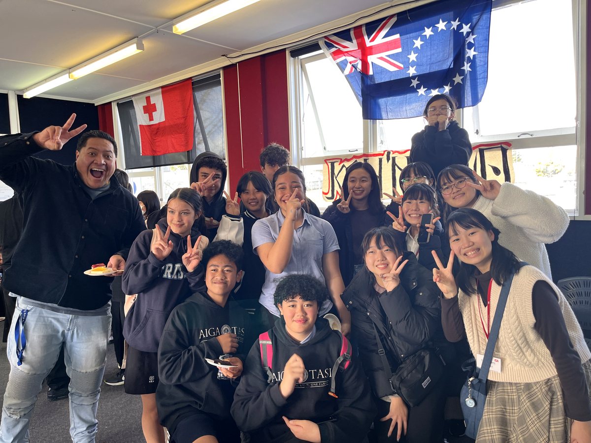 A vibrant group photo featuring diverse international and local students alongside a joyful...
