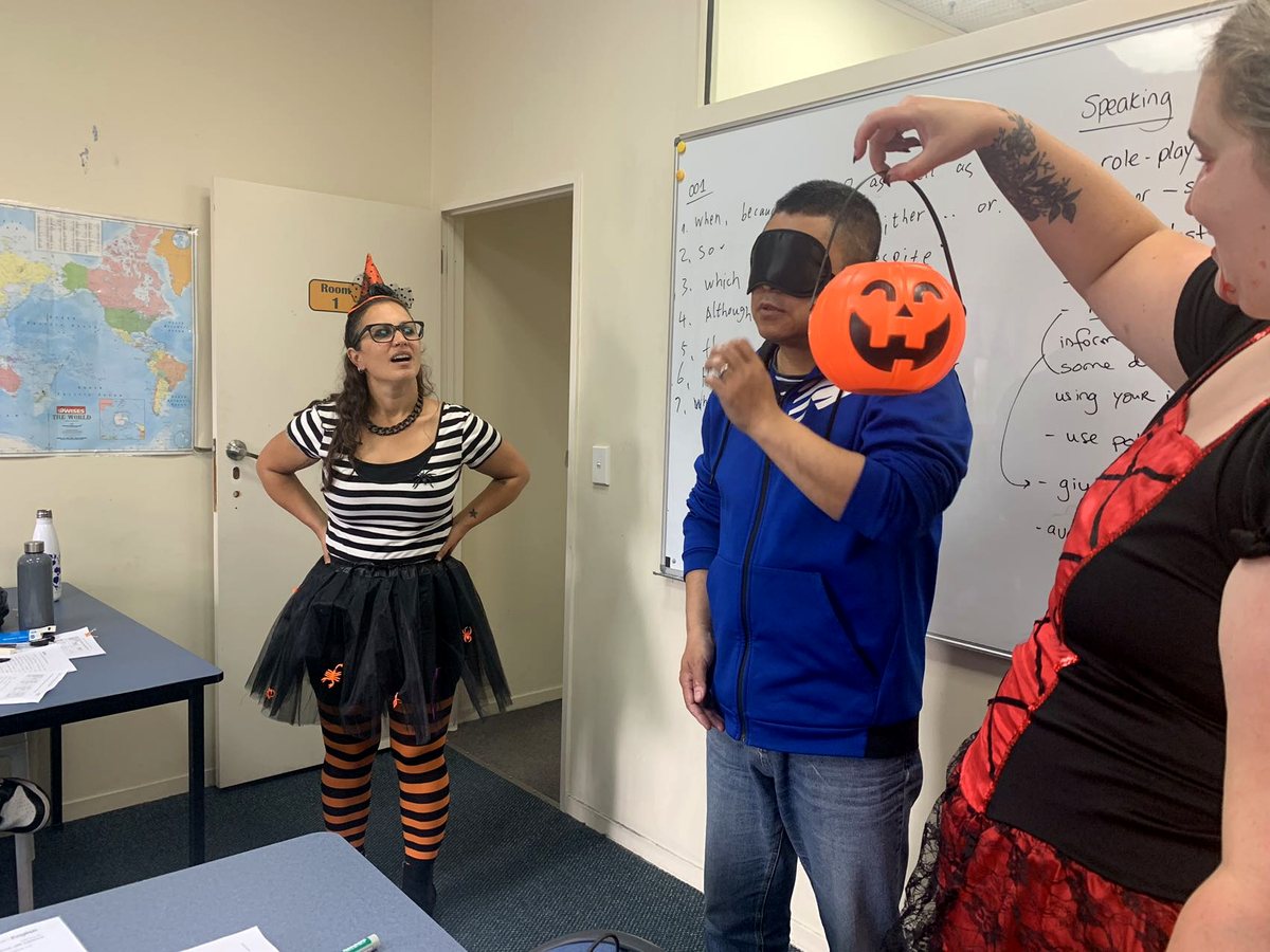 Students and teacher participating in a fun Halloween-themed classroom role-play game at Waikato Institute...