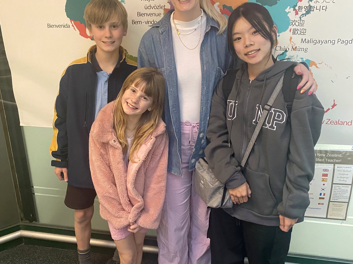 Teacher guiding English students during class